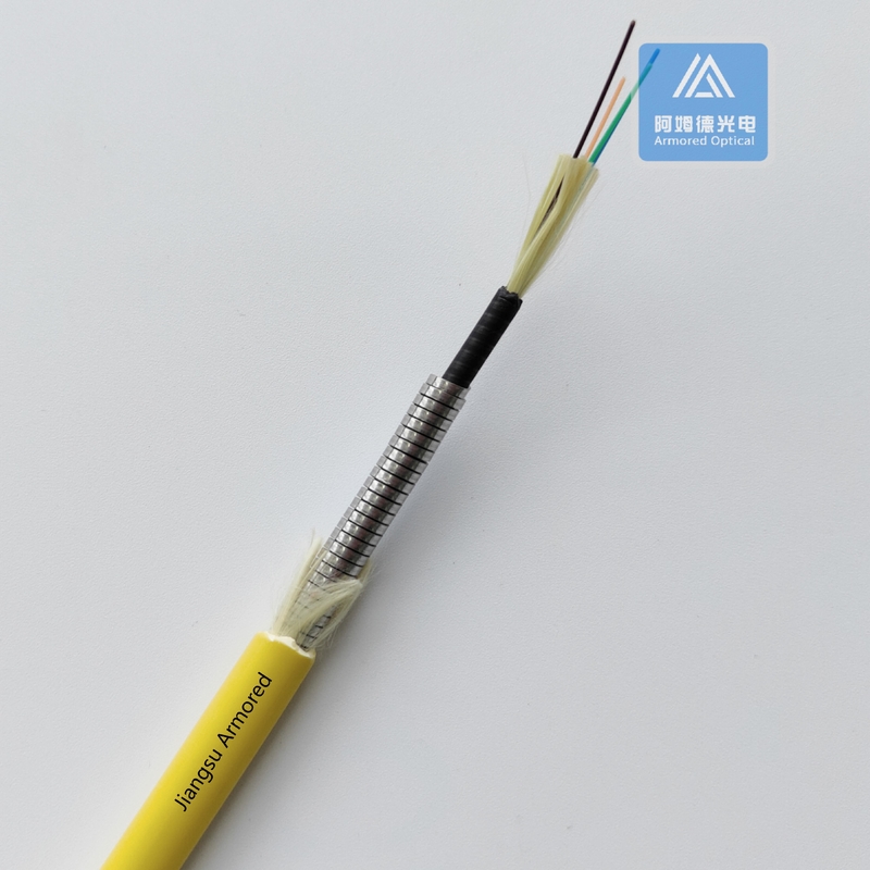 4 Cores SM Armored Fiber Cable Yellow LSZH 6.5mm Rodent Resistant FTTH Flexible Spiral Armored Fiber Cable